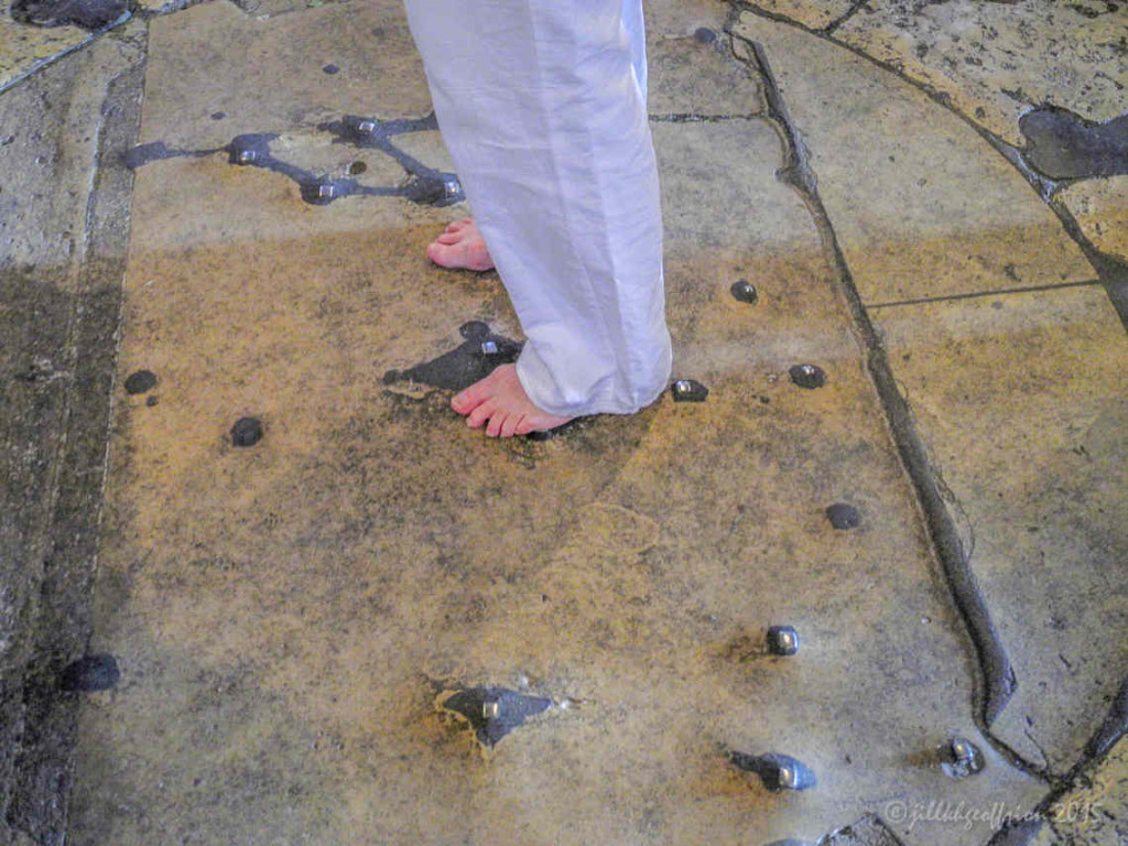 Woman's bare feet in the center of the labyrinth in the Chartres Cathedral by photographer Jill K H Geoffrion