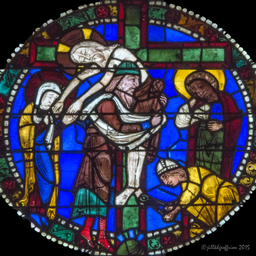 Jesus' body being taken off the cross in the Passion and Resurrection Window at Chartres Cathedral by photographer Jill K H Geoffrion